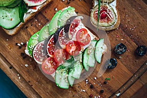 Sandwiche and bruschetta on a cutting board