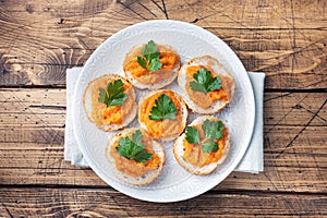 Sandwiches with bread zucchini caviar tomatoes onions. Homemade vegetarian food. Canned stewed vegetable. wooden background top