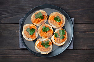 Sandwiches with bread zucchini caviar tomatoes onions. Homemade vegetarian food. Canned stewed vegetable. wooden background top