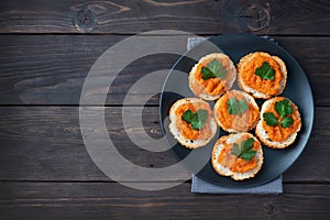 Sandwiches with bread zucchini caviar tomatoes onions. Homemade vegetarian food. Canned stewed vegetable. wooden background top