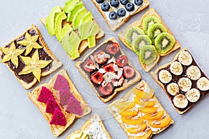 Sandwiches with cream cheese, chocolate fresh fruits and berries avocado, blueberries, bananas, kiwi, cherry, apricot, dragon