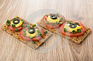 Sandwiches from crispbread with tomatoes, mayonnaise, scallion a