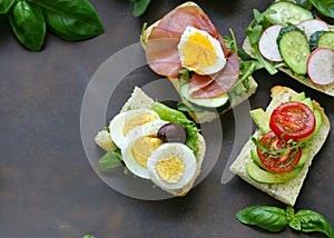 sandwiches with different fillings - vegetables, ham