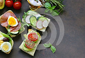 sandwiches with different fillings - vegetables, ham