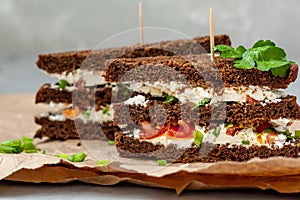 Sandwiches with healthy rye bread, feta and green onions