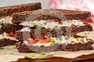 Sandwiches with healthy rye bread, feta and green onions