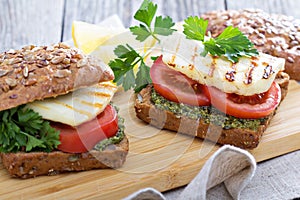 Sandwiches with pesto, vegetables and haloumi photo