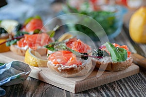 Sandwiches with red, black caviar and trout