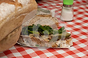 Sandwiches with rillettes, meat pate and pickled cucumber on street food market. Traditional polish sandwich with fat