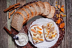 Sandwiches of rye bread with cream cheese, dried fruits, nuts