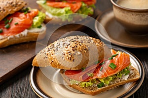 Sandwiches with salmon, lettuce and rye bread