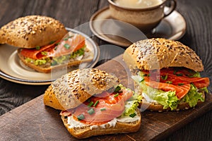 Sandwiches with salmon, lettuce and rye bread