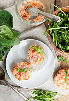 Sandwiches with salmon pate and arugula