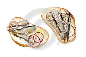 Sandwiches with sprats isolated on white background