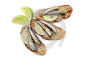 Sandwiches with sprats isolated on white background