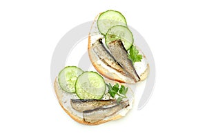 Sandwiches with sprats isolated on white background