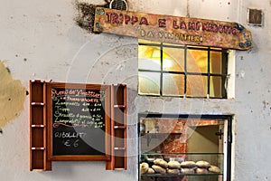 Sandwiches store handwritten wooden sign and blackboard menu