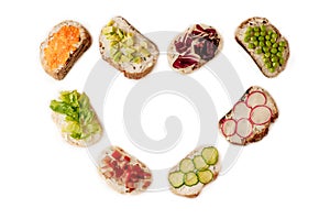 Sandwiches or tapas prepared with bread and tasty ingredients. Could be nice food for healthy breakfast ot lunch. Copy space for