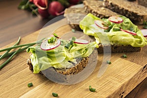 Sandwiches on wooden cutting board