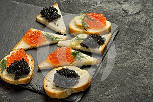 Sandwiges with red and black caviar