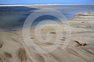 Sandy Bay Beach with beautiful color of the water and dunes in the background