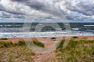 The sandy beach of the Baltic in a storm