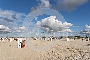 Sandy beach with beach baskets in Harlesiel