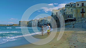 sandy beach and blue sea in Cefalu, town in Italian Metropolitan City of Palermo located on Tyrrhenian coast of Sicily