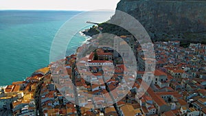 sandy beach and blue sea in Cefalu, town in Italian Metropolitan City of Palermo located on Tyrrhenian coast of Sicily