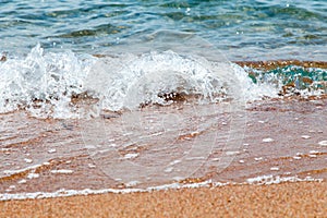 Sandy beach and blue sea wave. Beautiful natural background