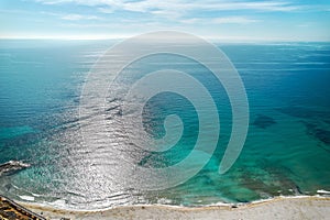 Sandy beach and bright turquoise waters of Mediterranean Sea