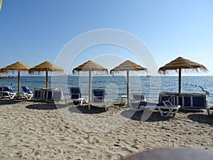 Sandy beach, chairs and umbrellas in La Manga, Spain