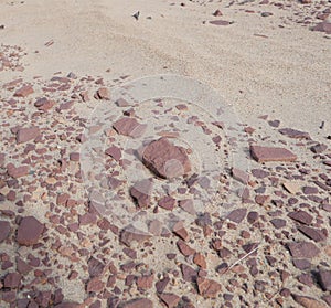 Sandy beach with different stones