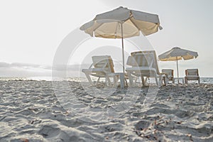 Sandy beach on Greek Kos island with parasols and