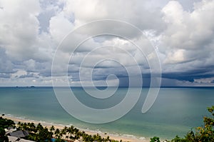 Sandy beach and green sea