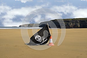 Sandy beach with jolly roger flag