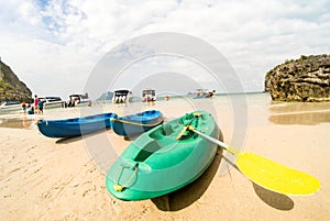 Sandy beach with kayaks amd speedboats in Ang Thong near Ko Samu Thailand photo