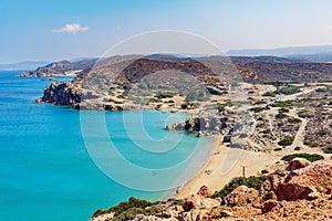 Sandy beach and lagoon with clear blue water at Crete island near Sitia town, Greece.