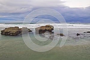 sandy beach with large rocks . Praia de Augas Santas photo