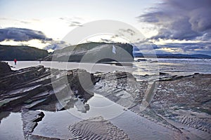 sandy beach with large rocks . Praia de Augas Santas photo