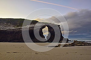 sandy beach with large rocks . Praia de Augas Santas photo