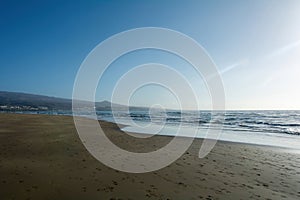 Sandy beach of Maspalomas with a view of the city on Gran Canaria, Spain