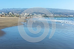 Sandy beach of Maspalomas with a view of the city on Gran Canaria, Spain