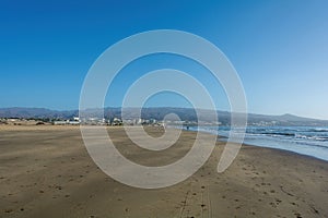 Sandy beach of Maspalomas with a view of the city on Gran Canaria, Spain