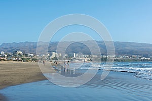 Sandy beach of Maspalomas with a view of the city on Gran Canaria, Spain