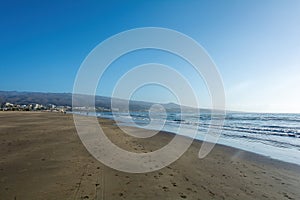 Sandy beach of Maspalomas with a view of the city on Gran Canaria, Spain