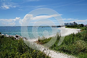 Sandy beach at the mouth of the Cape Fear River in Southport NC photo