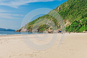 Sandy beach and ocean with mountain in Brazil, Floripa