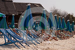 Sun loungers and parasols on the sandy beach