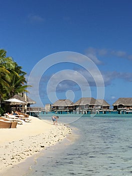 Sandy beach and overwater bungalows